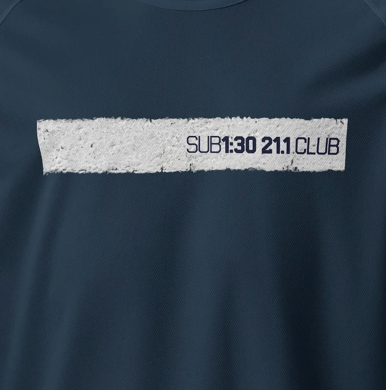 A white line from the road that has the graphics 'SUB 1:30 21:1 CLUB' in black.